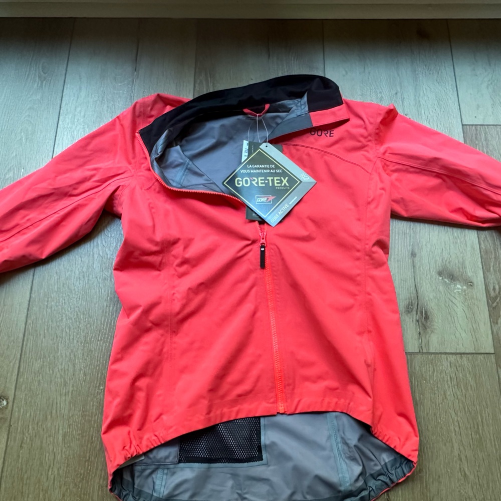 Gore-Tex shell cycling athletic jacket. Salmon/hot pink and black